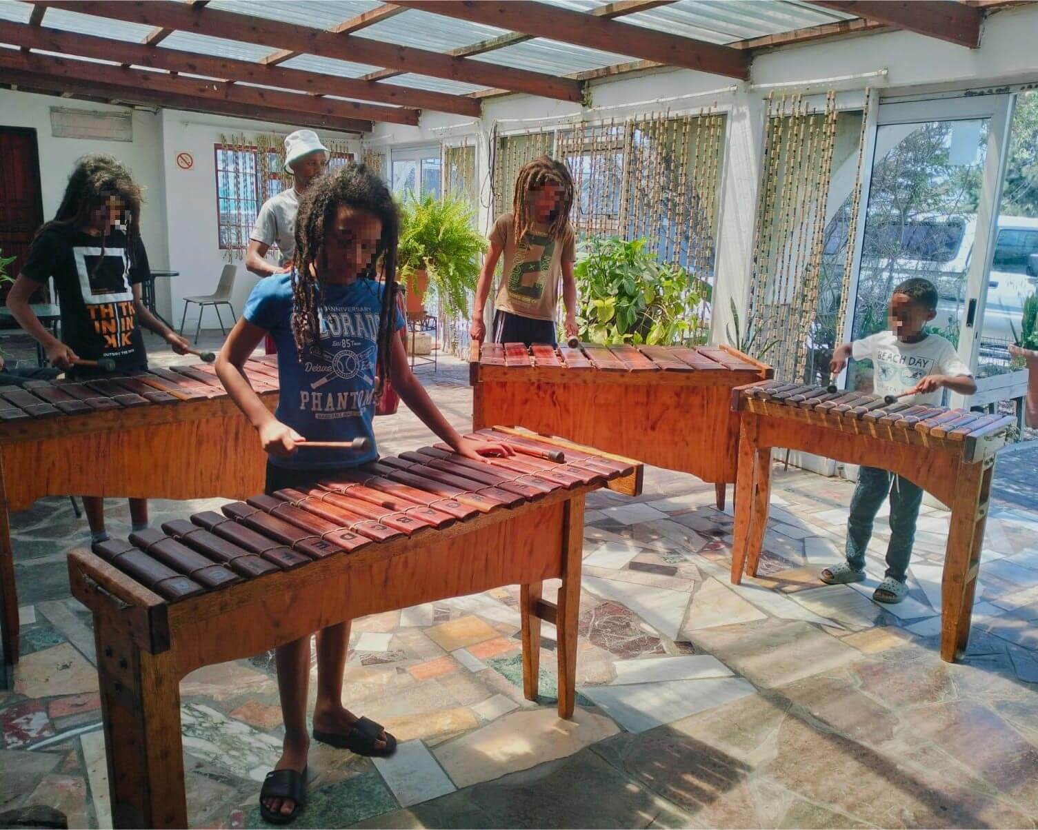 Boys playing the marimba